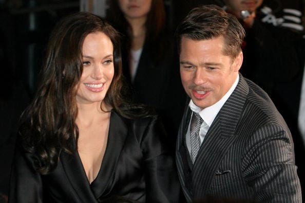 TOKYO, JAPAN - JANUARY 29: Actress Angelina Jolie (L) and Actor Brad Pitt (R) greet fans during 'The Curious Case of Benjamin Button' Japan Premiere at Roppongi Hills on January 29, 2009 in Tokyo, Japan. The film will open in Japan on Feburary 7. (Photo by Kiyoshi Ota/Getty Images)