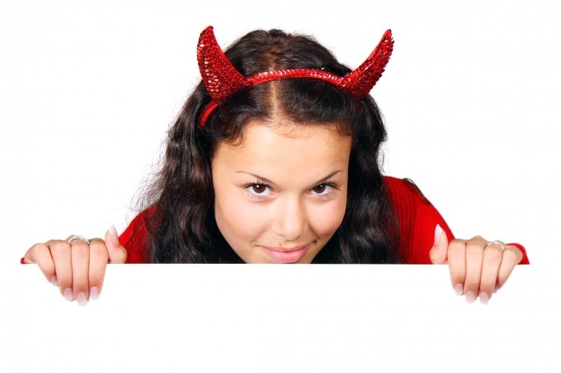 studio-shot-of-cute-young-woman-wearing-devils-costume